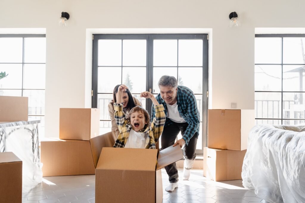 Why Moving to Florida is the Best Decision You Can Make Happy family enjoying a new home moving day, with boxes and laughter.